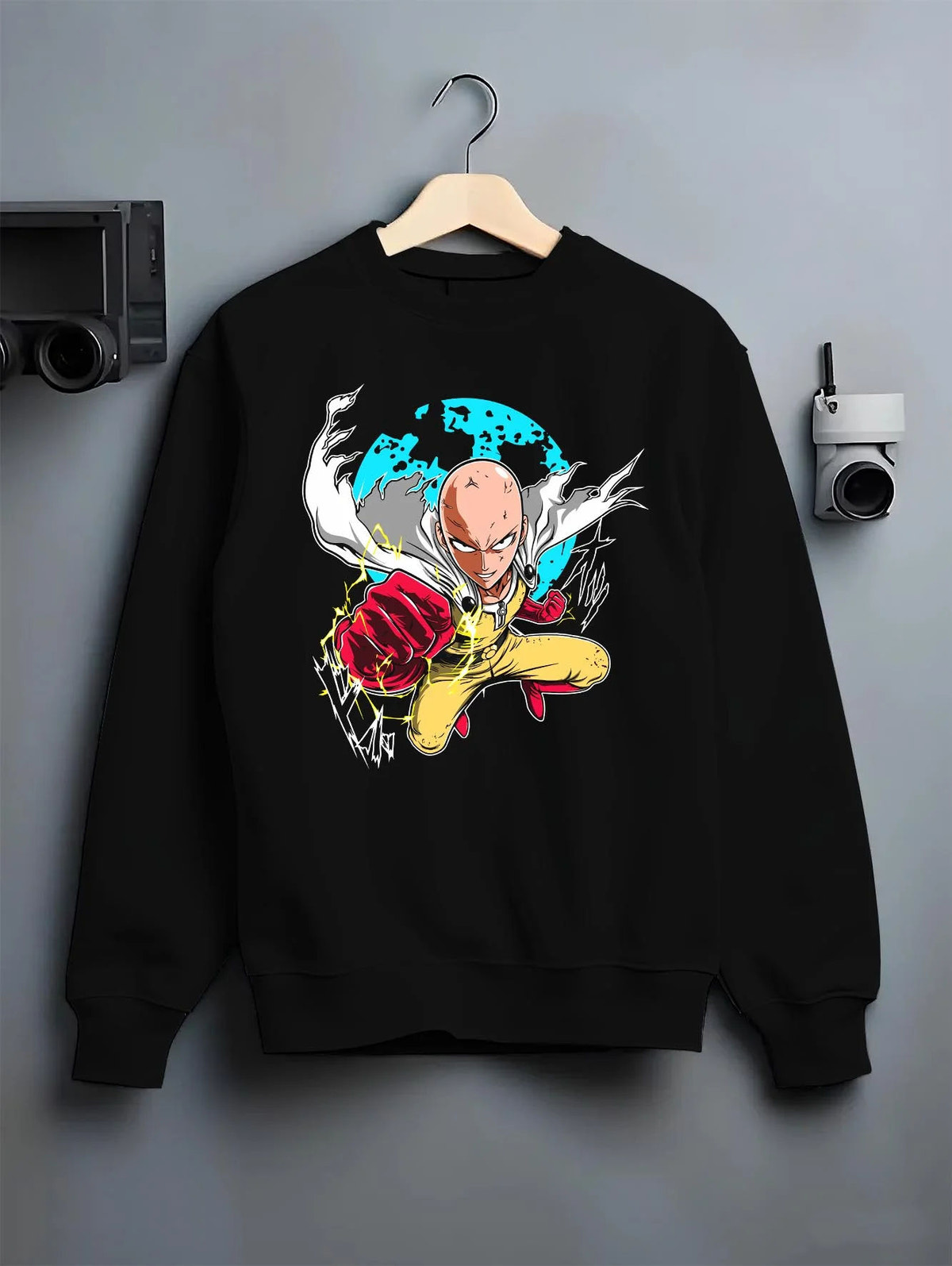 Black crewneck sweatshirt on hanger featuring Saitama Serious Punch One Punch Man artwork.