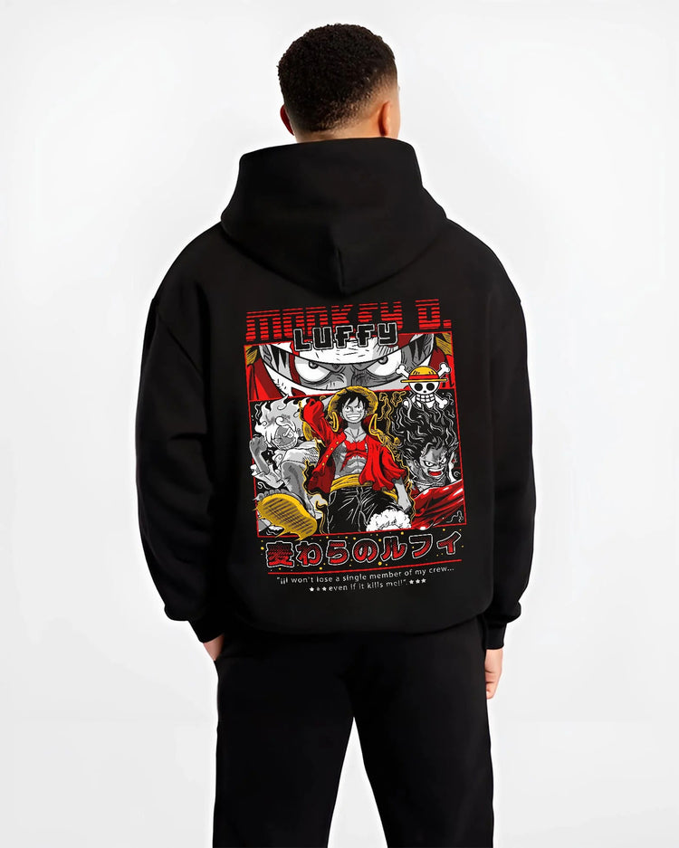 Black hoodie worn by male model from the back featuring Luffy Gear forms One Piece artwork.