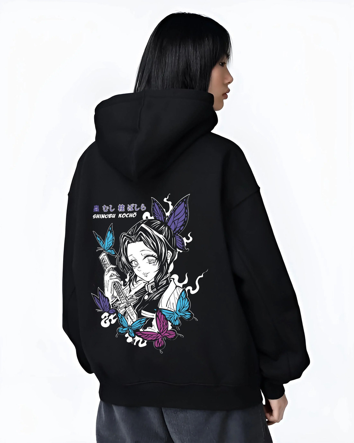 Black hoodie worn by female model from the back featuring Shinobu Kocho butterfly poison Demon Slayer artwork.