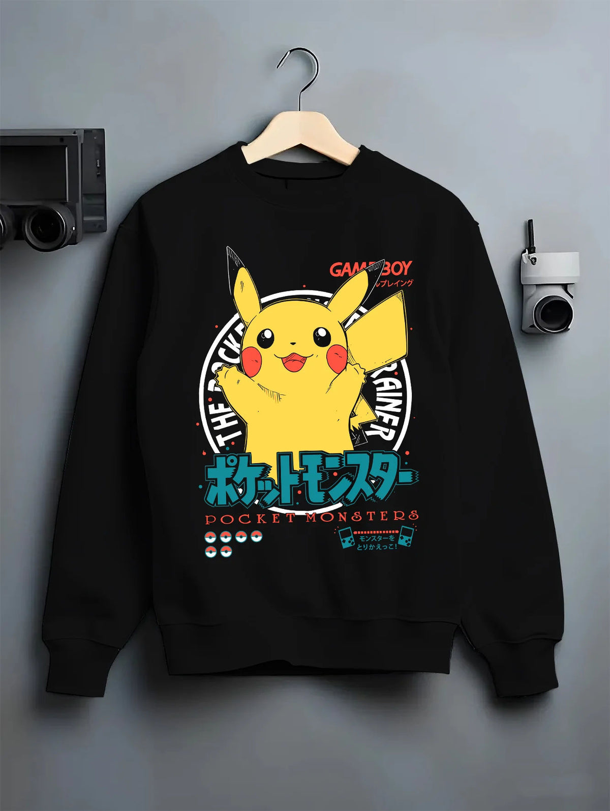 Black crewneck sweatshirt on hanger showing Pikachu from Pokémon: happy Game Boy illustration