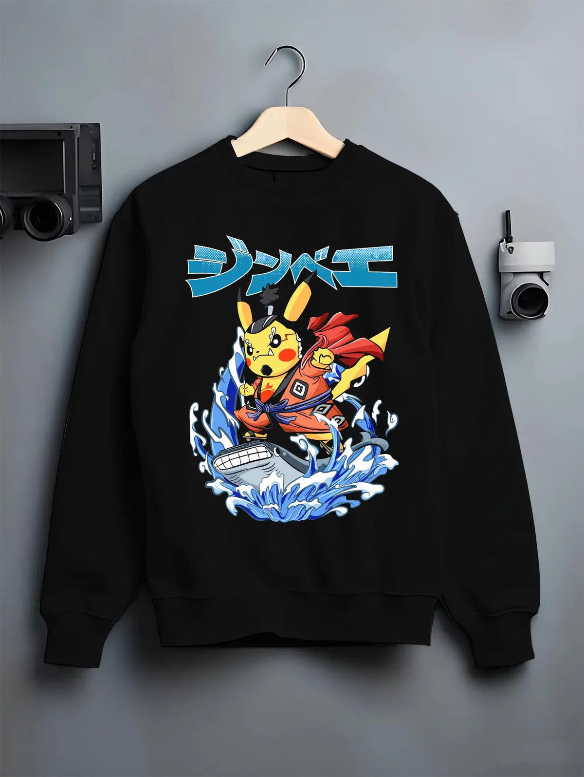 Black crewneck sweatshirt on hanger featuring Pikachu martial arts crossover Pokemon artwork.
