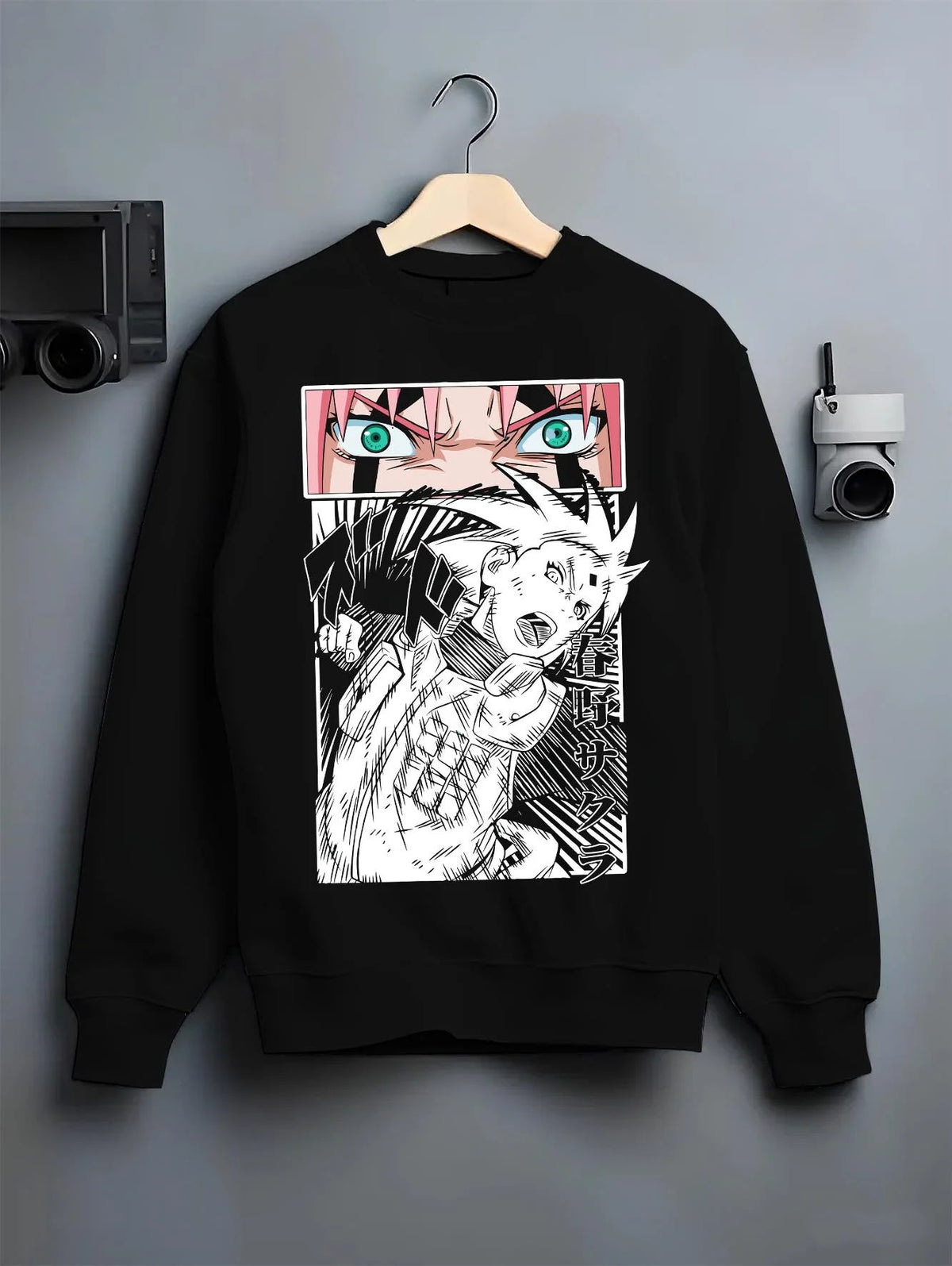Black crewneck sweatshirt on hanger featuring Sakura Haruno chakra strength Naruto artwork.