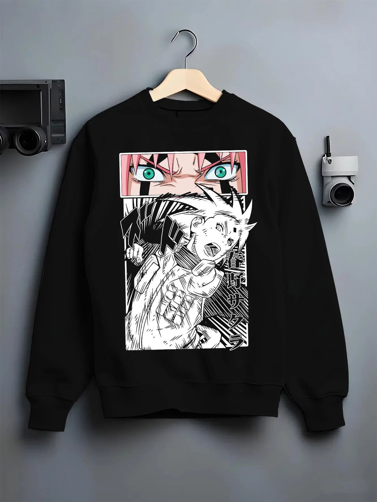 Black crewneck sweatshirt on hanger featuring Sakura Haruno chakra strength Naruto artwork.