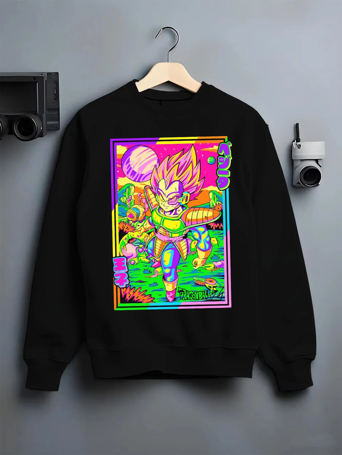 Black crewneck sweatshirt on hanger featuring Vegeta vaporwave Saiyan power Dragon Ball artwork.