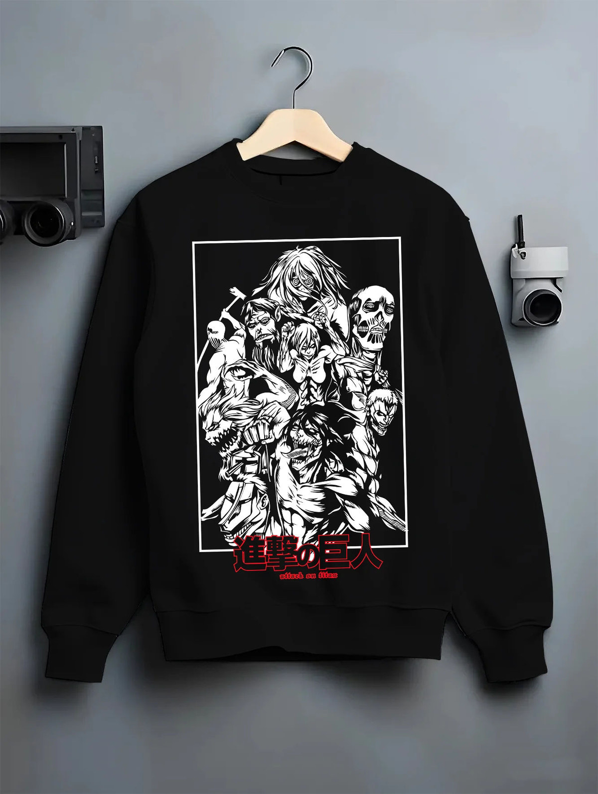 Black crewneck sweatshirt on hanger showing Attack on Titan: Eren and titans montage