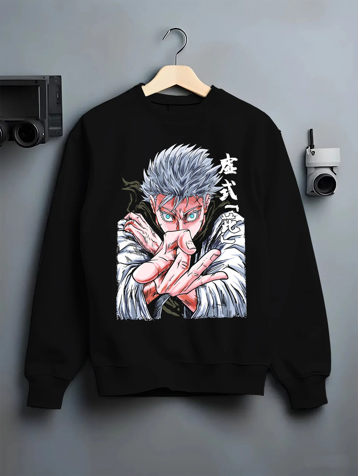 Black crewneck sweatshirt on hanger with Satoru Gojo in fighting pose from Jujutsu Kaisen illustrated back graphic