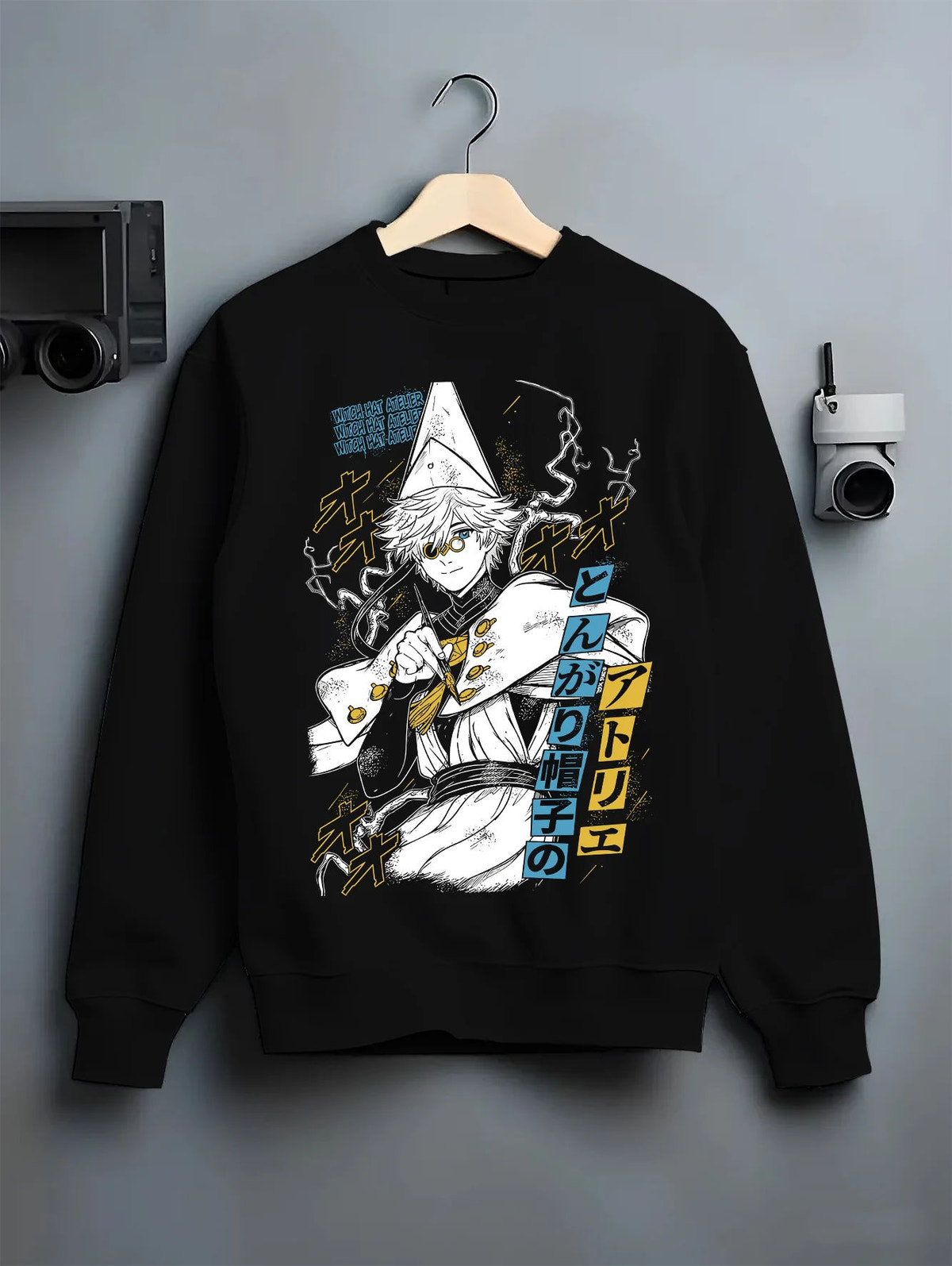 Black crewneck sweatshirt on hanger showing Qifrey from Witch Hat Atelier: Witch Hat Atelier