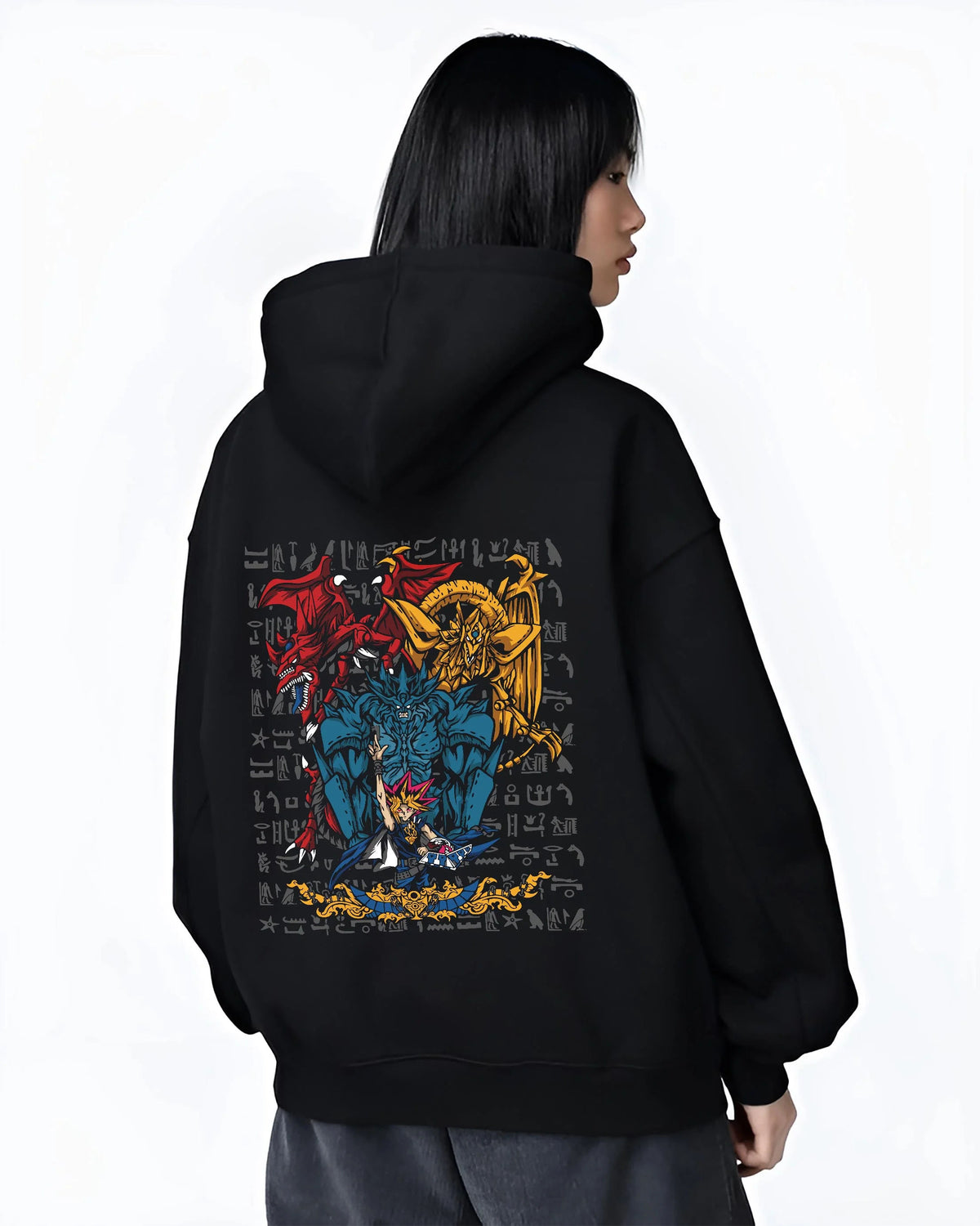 Black hoodie worn by female model from the back featuring Yugi with the Egyptian Gods Yu-Gi-Oh! artwork.