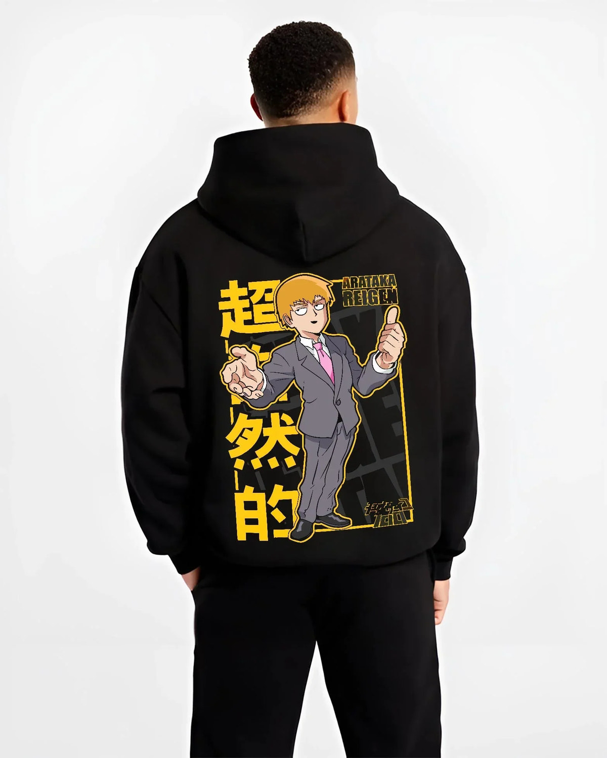 Black hoodie worn by male model, back view with Reigen Hoodie Mob Psycho 100 Master of Exorcism graphic bold anime graphic.