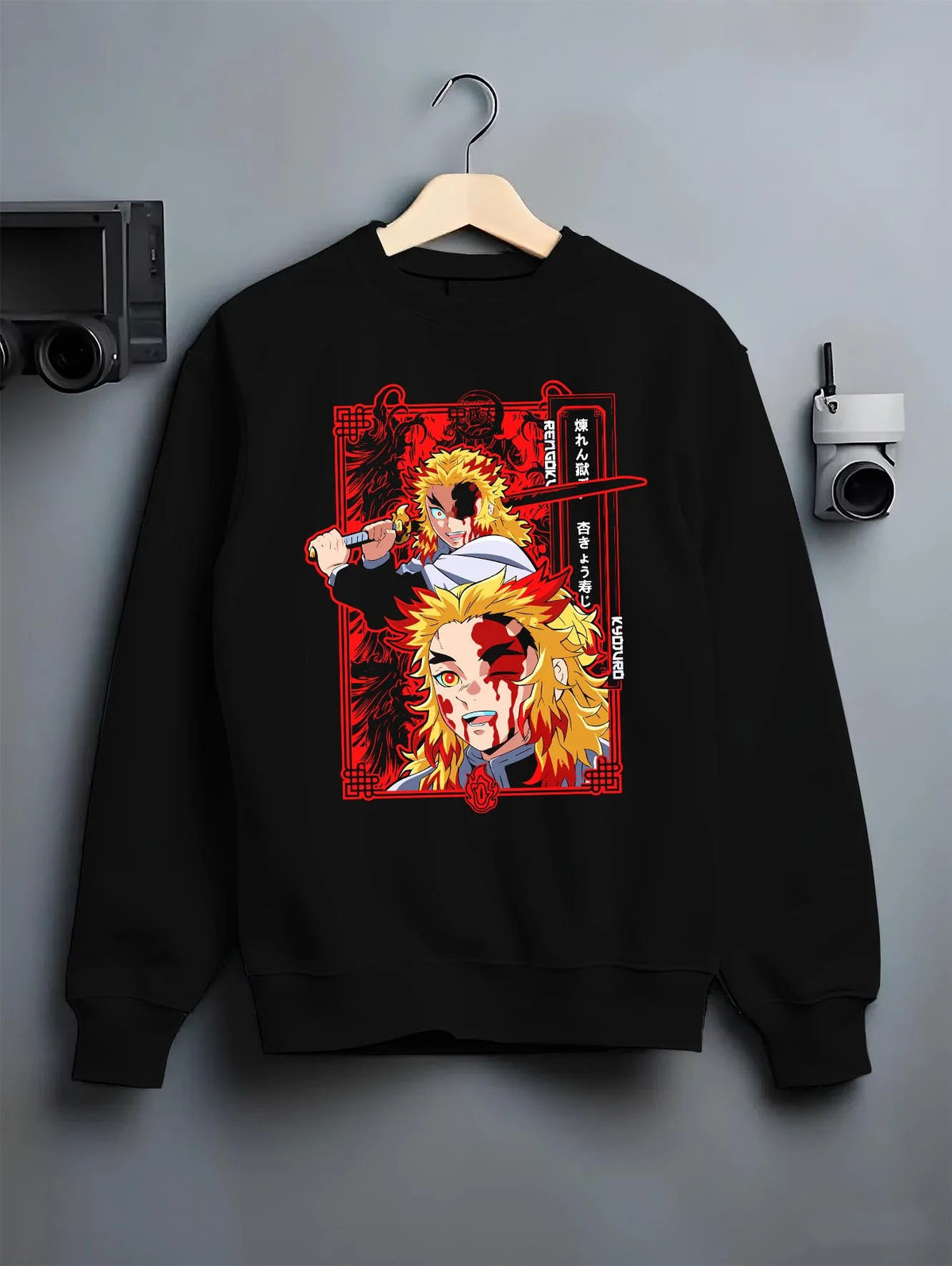 Black crewneck sweatshirt on hanger featuring Kyojuro Rengoku final battle Demon Slayer artwork.