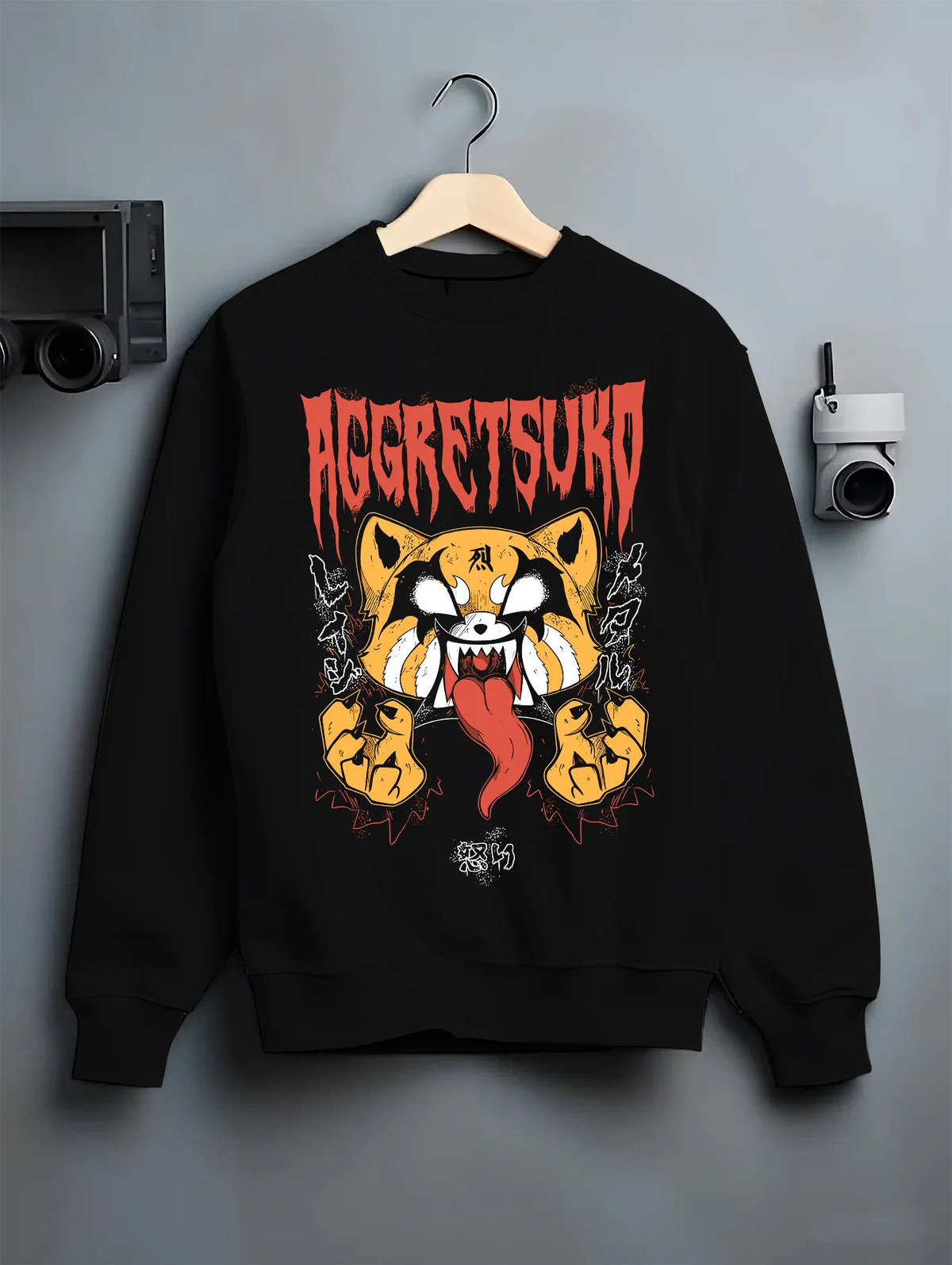 Black crewneck sweatshirt on hanger showing Retsuko from Aggretsuko: aggressive red panda