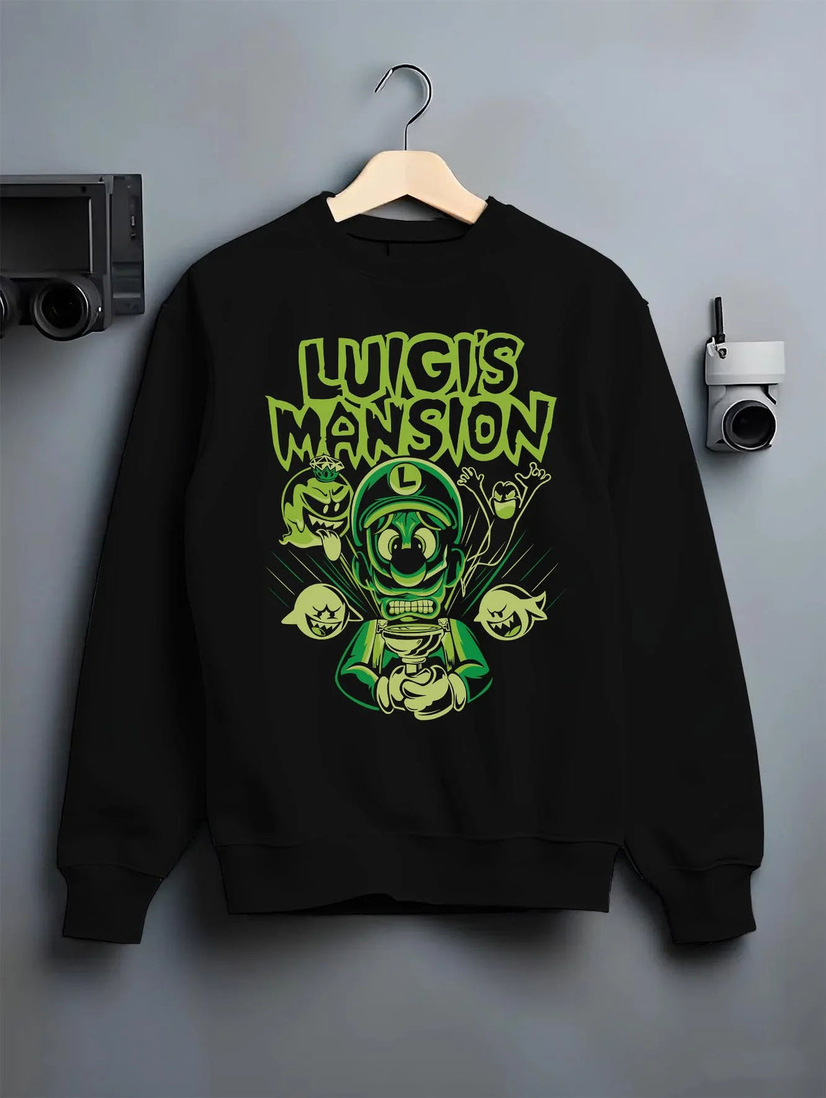 Black crewneck sweatshirt on hanger featuring Luigi ghost hunter Luigi's Mansion artwork.