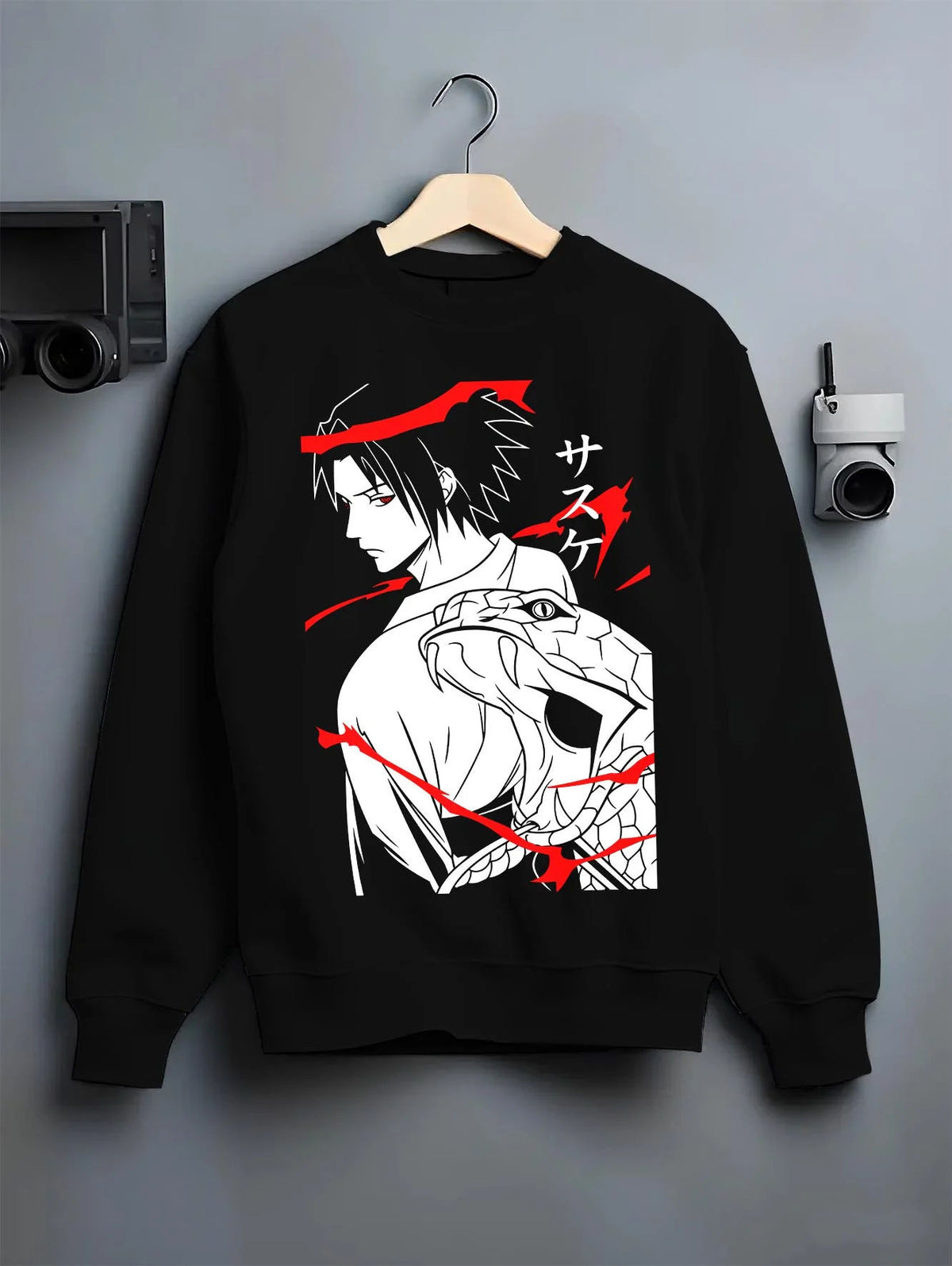 Black crewneck sweatshirt on hanger featuring Sasuke Uchiha Sharingan snake power Naruto artwork.