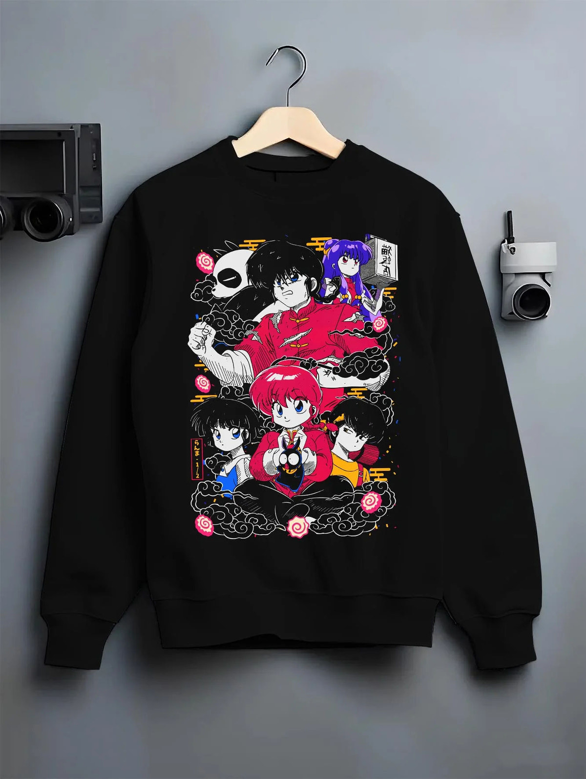 Black crewneck sweatshirt on hanger featuring Ranma 1/2 martial arts cast artwork.