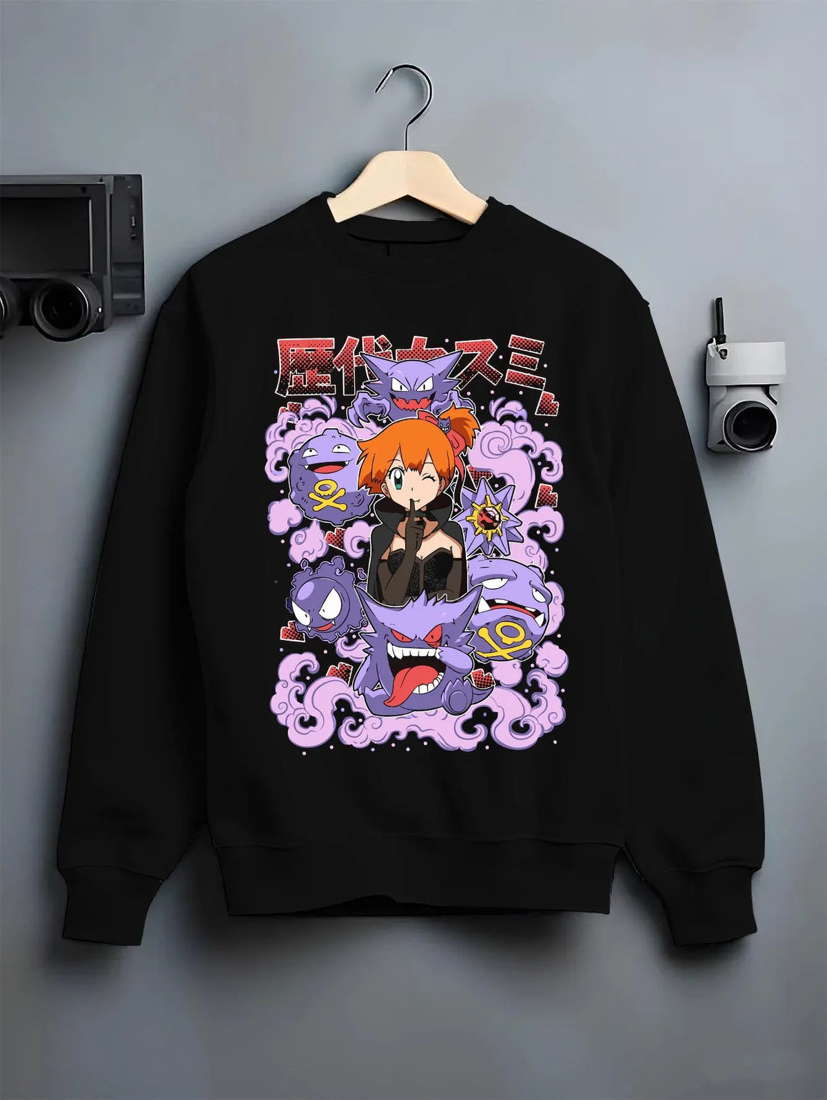 Black crewneck sweatshirt on hanger featuring Team Rocket and Gengar villain crew Pokemon artwork.
