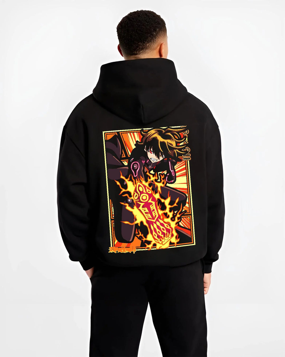 Black hoodie worn by male model from the back featuring Shinra Kusakabe Devil's Footprints Fire Force artwork.