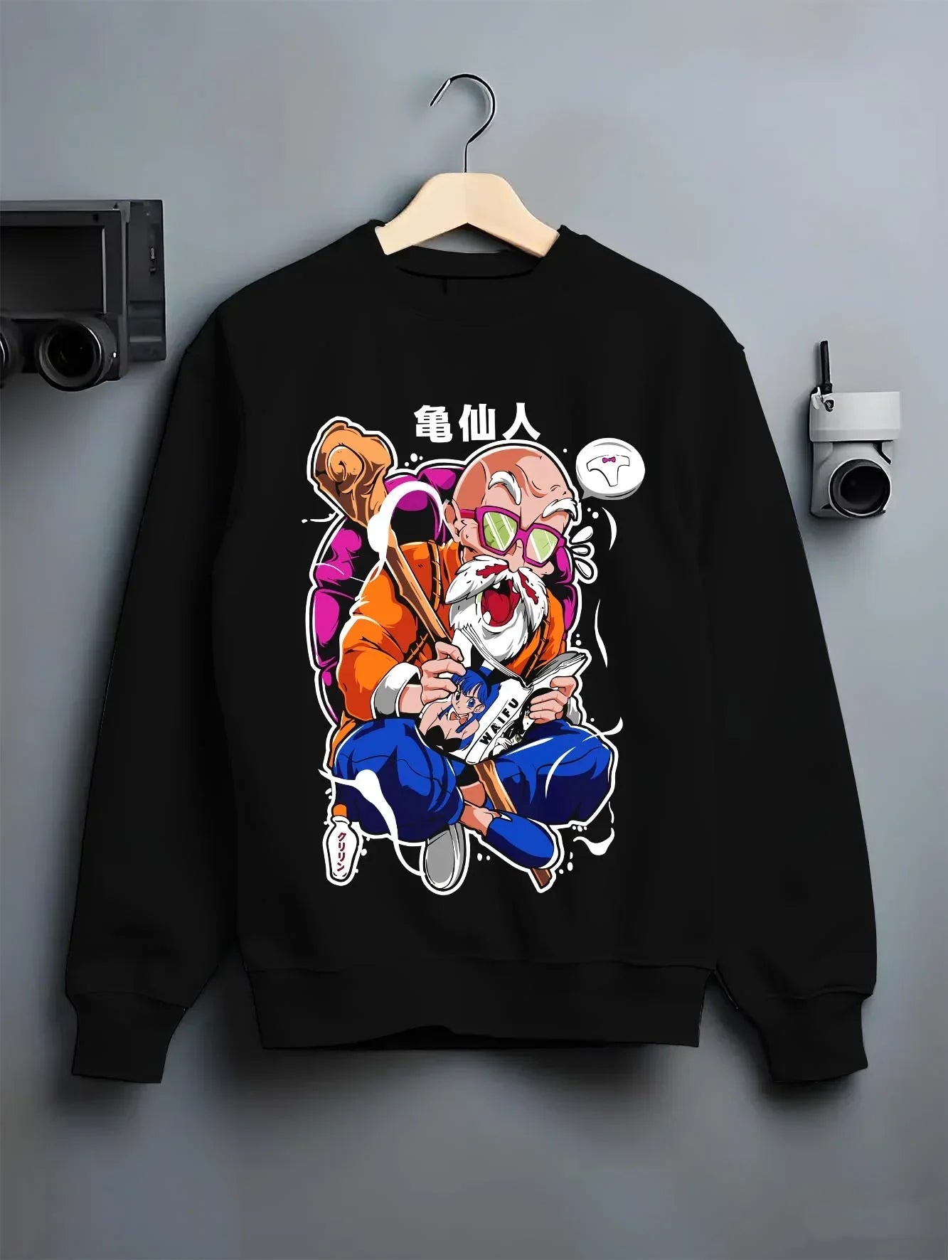 Black crewneck sweatshirt on hanger with Master Roshi Hoodie Dragon Ball Martial Arts graphic streetwear graphic.
