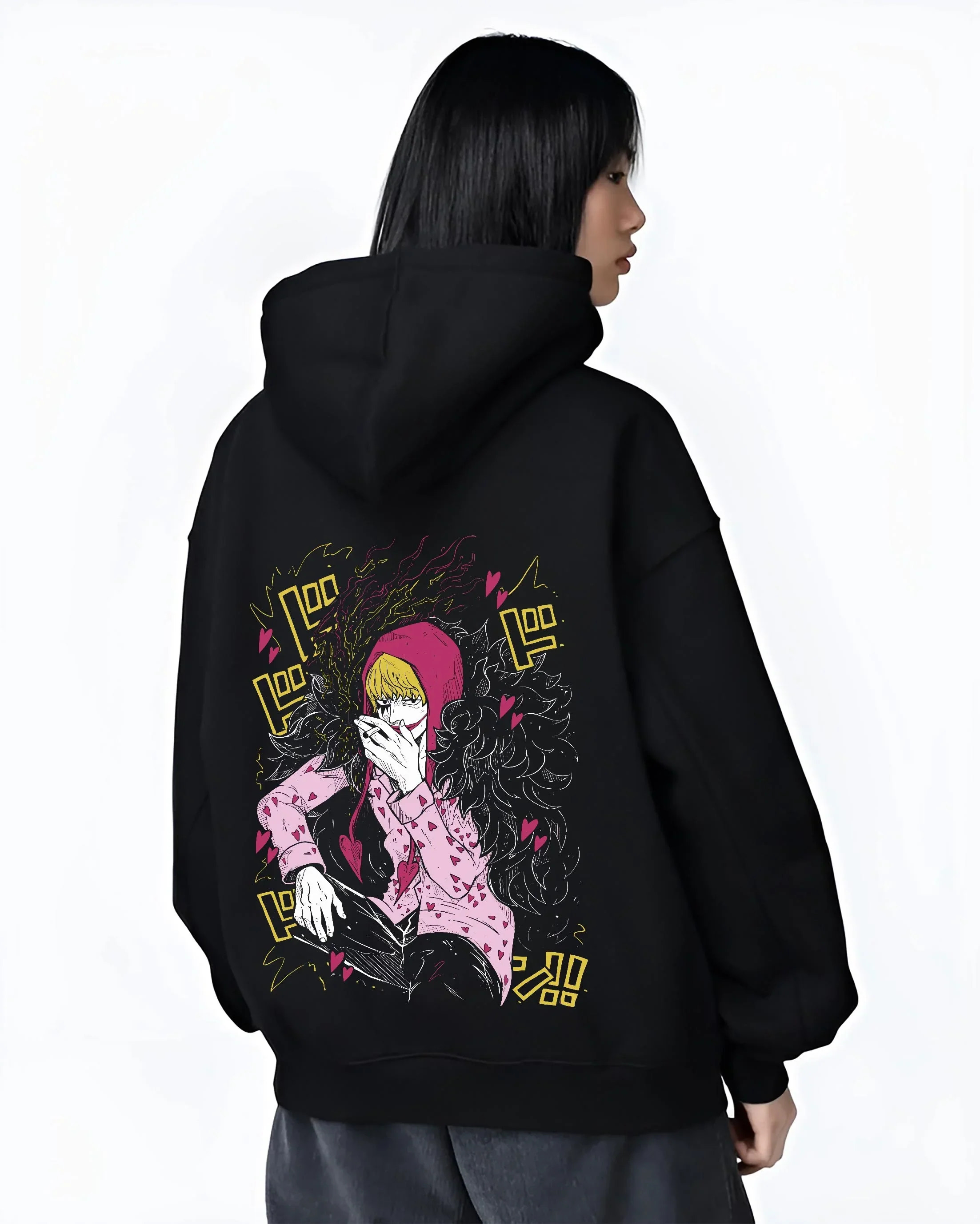 Black hoodie worn by female model, back view, highlighting nostalgic 90s inspired artwork of Corazon Donquixote Rosinante from One Piece.