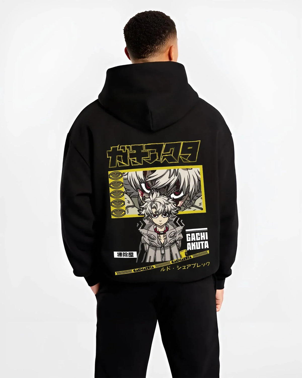 Black hoodie worn by male model, back view with Rudo Hoodie Gachiakuta Character Action Scene graphic streetwear graphic.