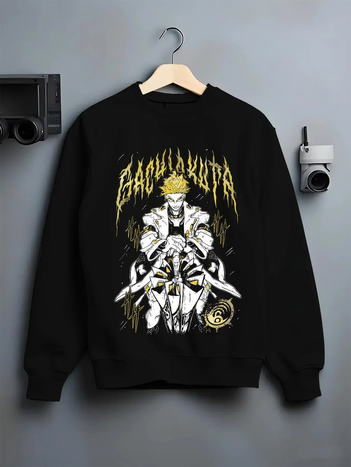 Black crewneck sweatshirt on hanger with Rudo Hoodie Gachiakuta Skeletal Yellow Art graphic streetwear graphic.