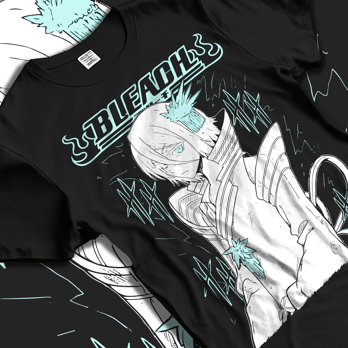 Black T-shirt laid flat with natural folds featuring Rukia Kuchiki ice moon Zanpakuto Bleach artwork.