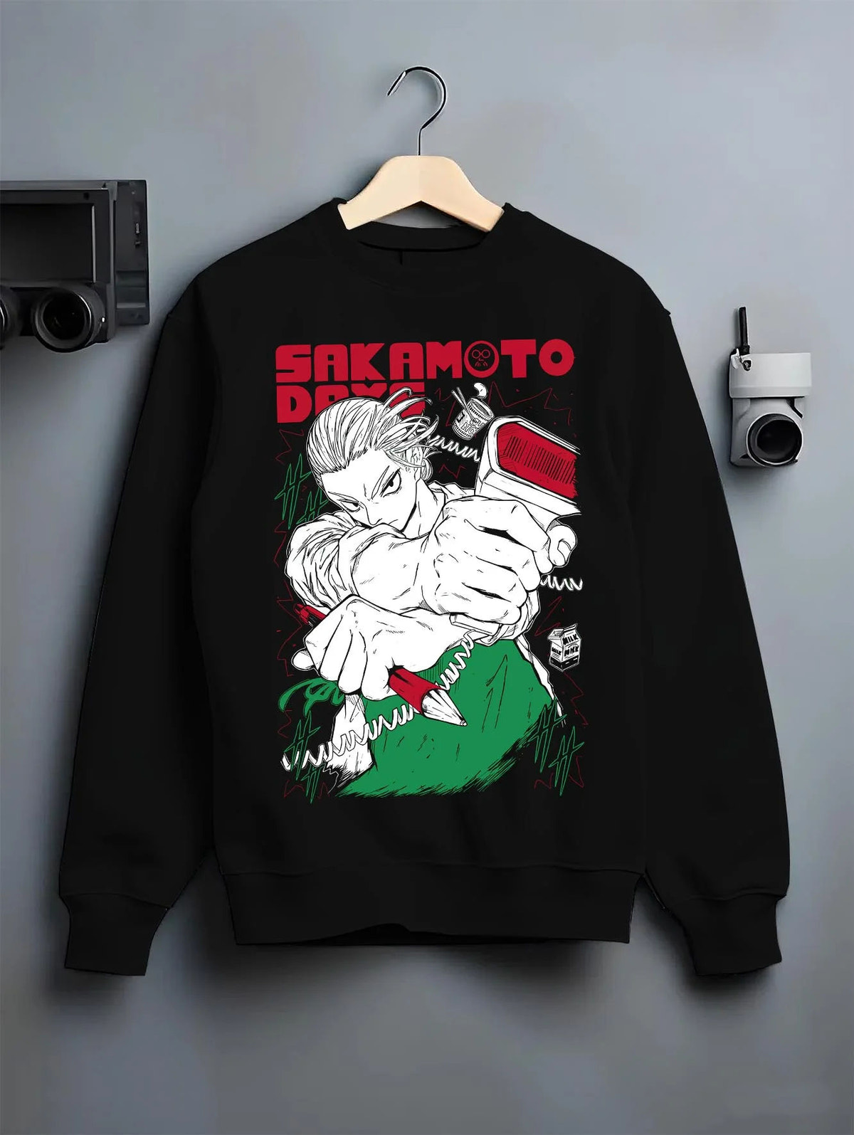 Black crewneck sweatshirt on hanger featuring Sakamoto Days cool assassin fight scene artwork.