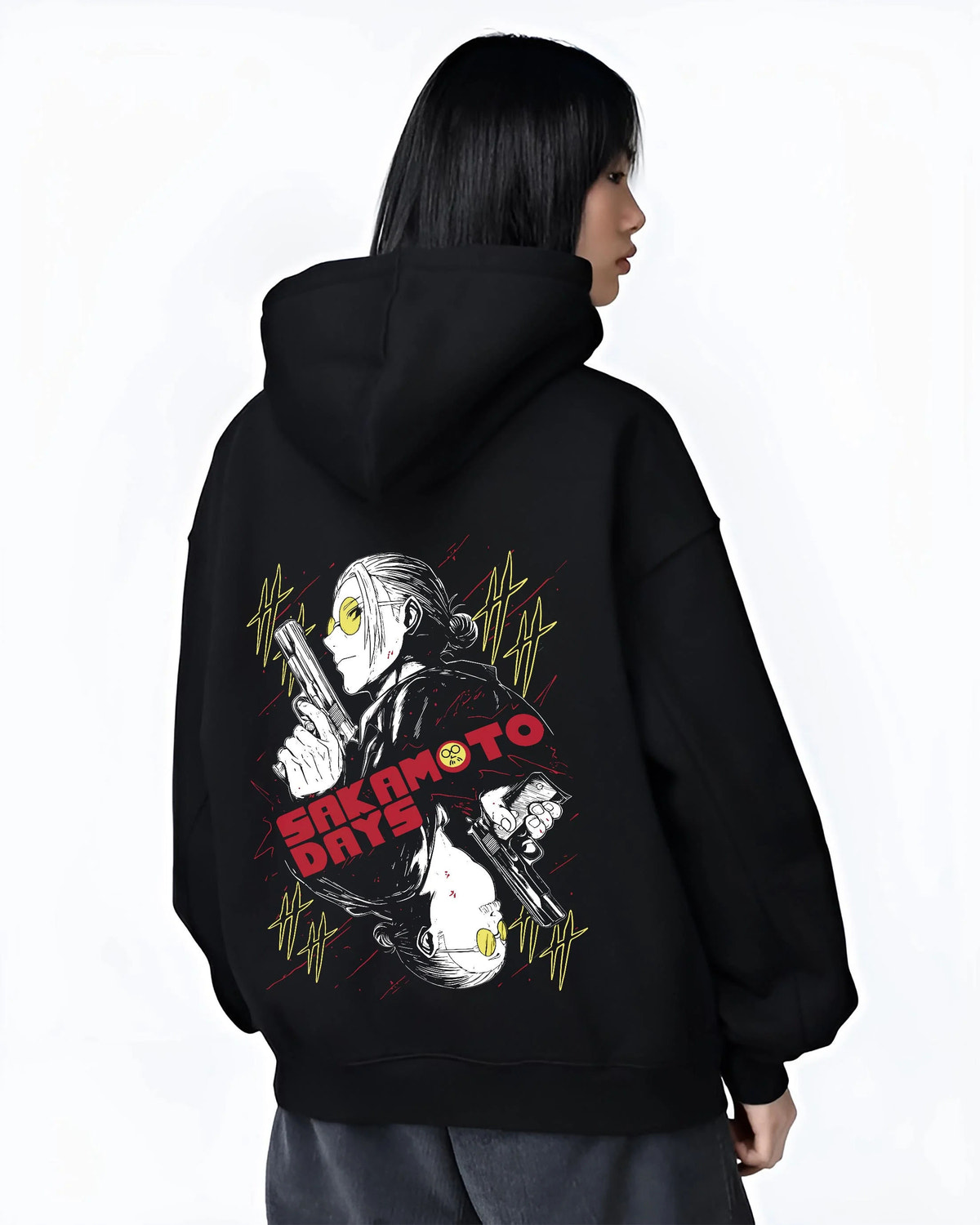 Black hoodie worn by female model from the back featuring Sakamoto Days elite assassin gunfight artwork.