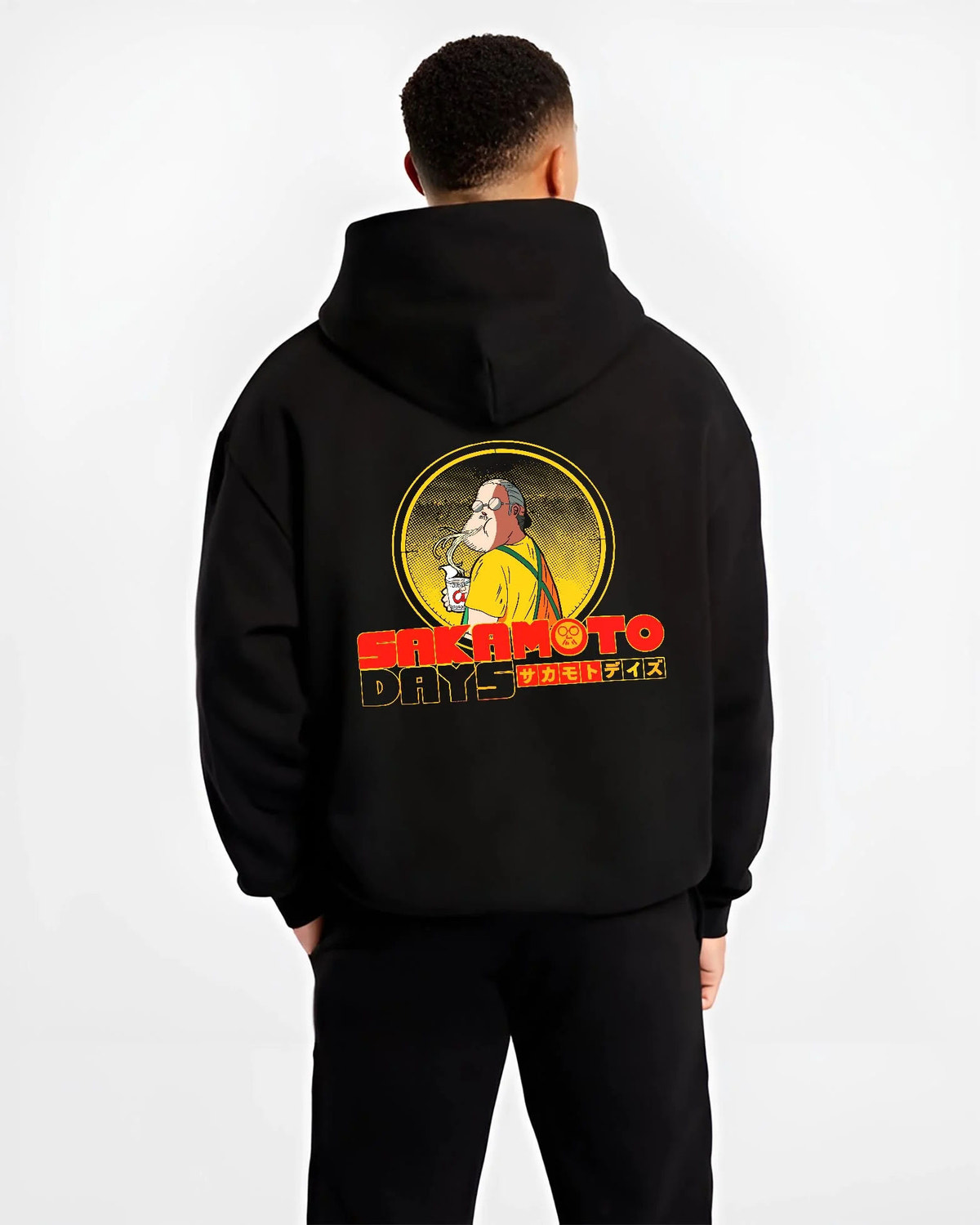 Black hoodie worn by male model from the back featuring Sakamoto Days veteran assassin artwork.