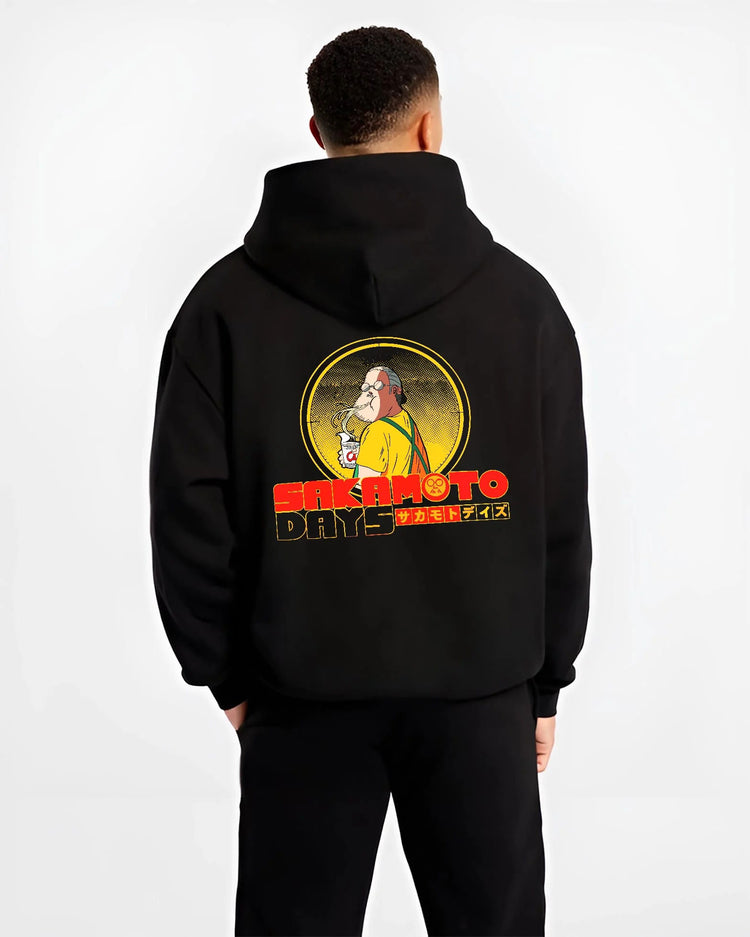 Black hoodie worn by male model from the back featuring Sakamoto Days veteran assassin artwork.