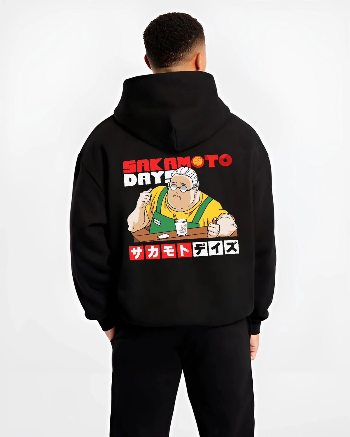 Black hoodie worn by male model from the back featuring Taro Sakamoto golden lion graphic Sakamoto Days artwork.