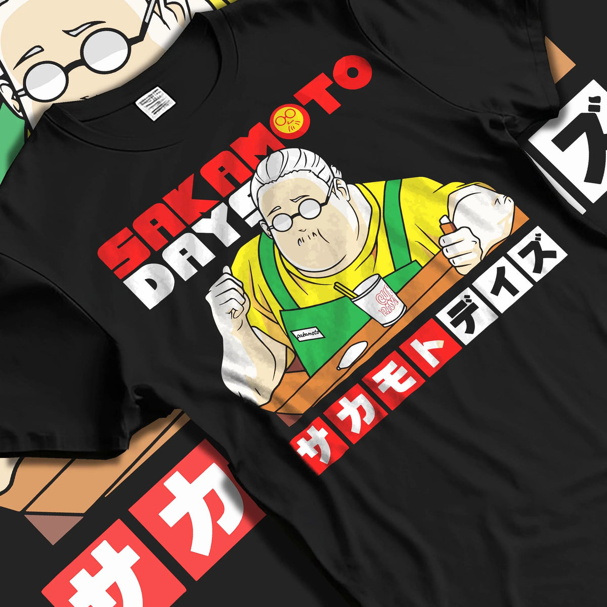 Black T-shirt laid flat with natural folds featuring Taro Sakamoto golden lion graphic Sakamoto Days artwork.