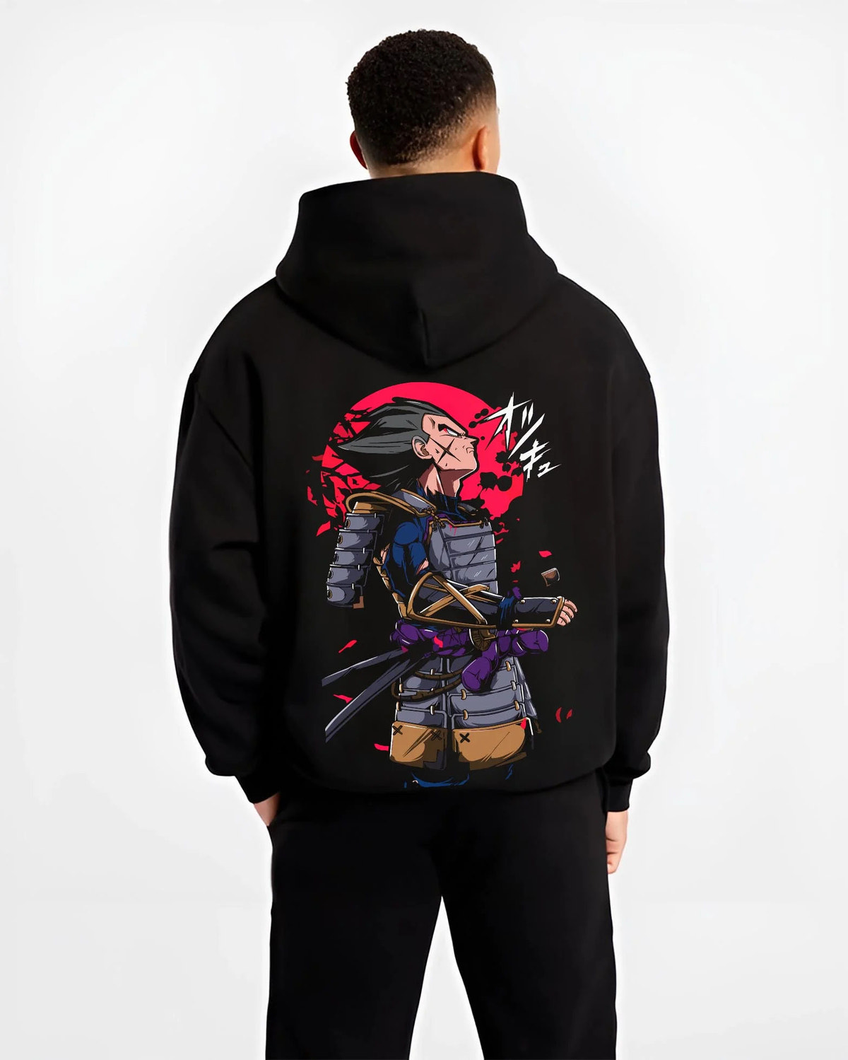 Black hoodie worn by male model from the back featuring Vegeta samurai armour Saiyan warrior Dragon Ball artwork.