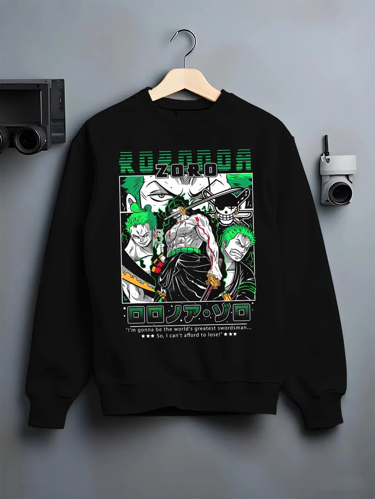 Black crewneck sweatshirt on hanger featuring Roronoa Zoro Santoryu three sword style One Piece artwork.