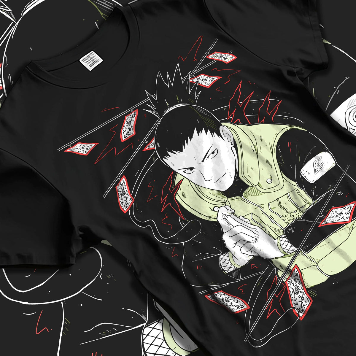 Black T-shirt laid flat with natural folds featuring Shikamaru Nara Shadow Possession Jutsu Naruto artwork.