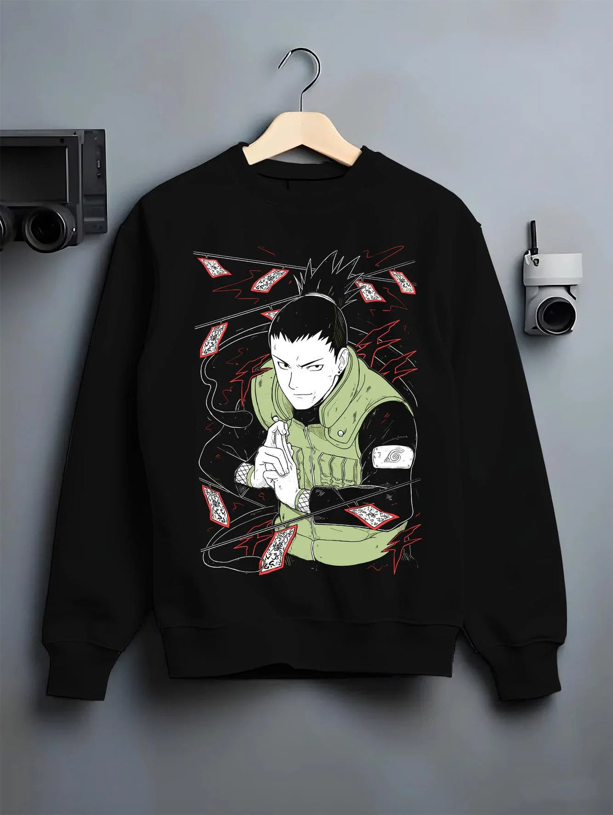 Black crewneck sweatshirt on hanger featuring Shikamaru Nara Shadow Possession Jutsu Naruto artwork.