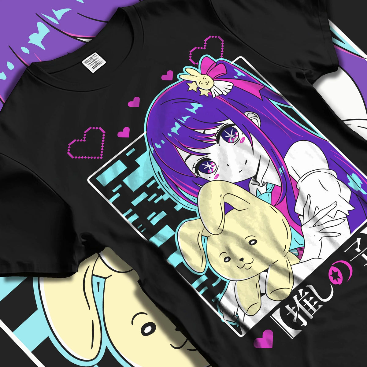 Black T-shirt laid flat with natural folds featuring Ai Hoshino idol star rabbit portrait Oshi no Ko artwork.