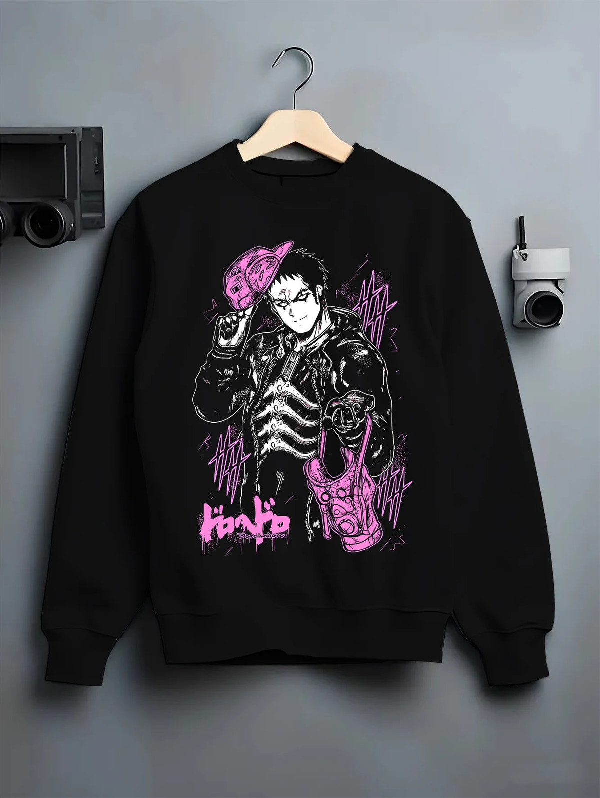 Black crewneck sweatshirt on hanger with Black-haired man in suit, purple creature/mask from Dorohedoro illustrated back