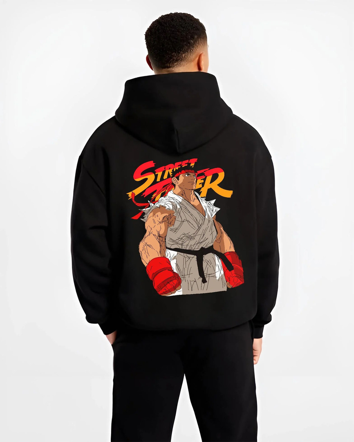 Black hoodie worn by male model from the back featuring Ryu Shoryuken World Warrior Street Fighter artwork.