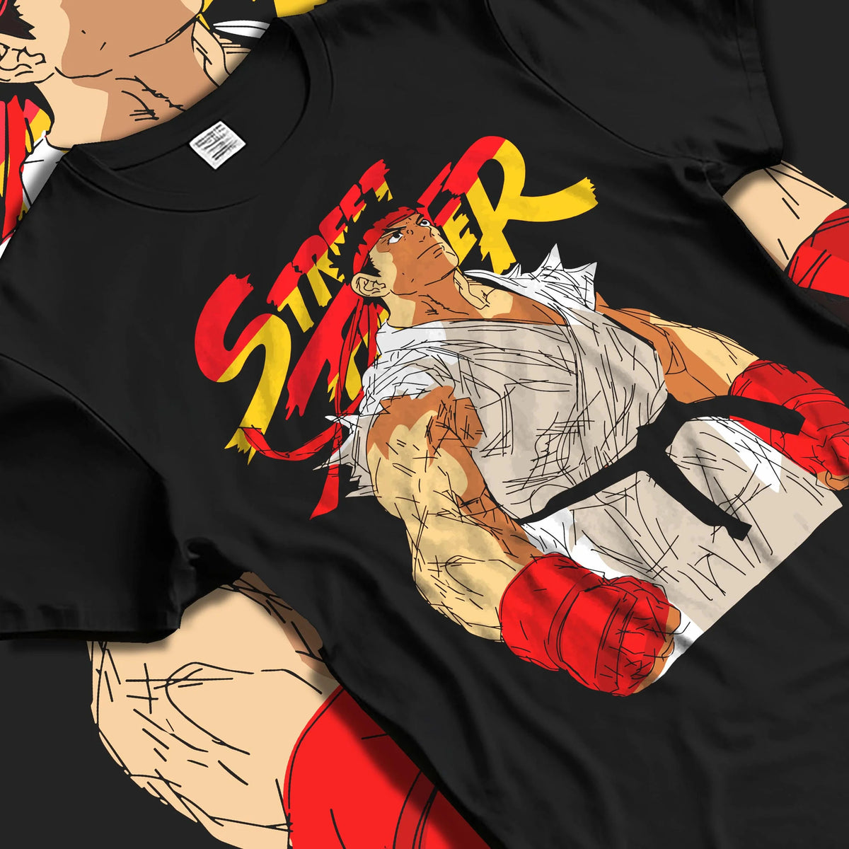 Black T-shirt laid flat with natural folds featuring Ryu Shoryuken World Warrior Street Fighter artwork.