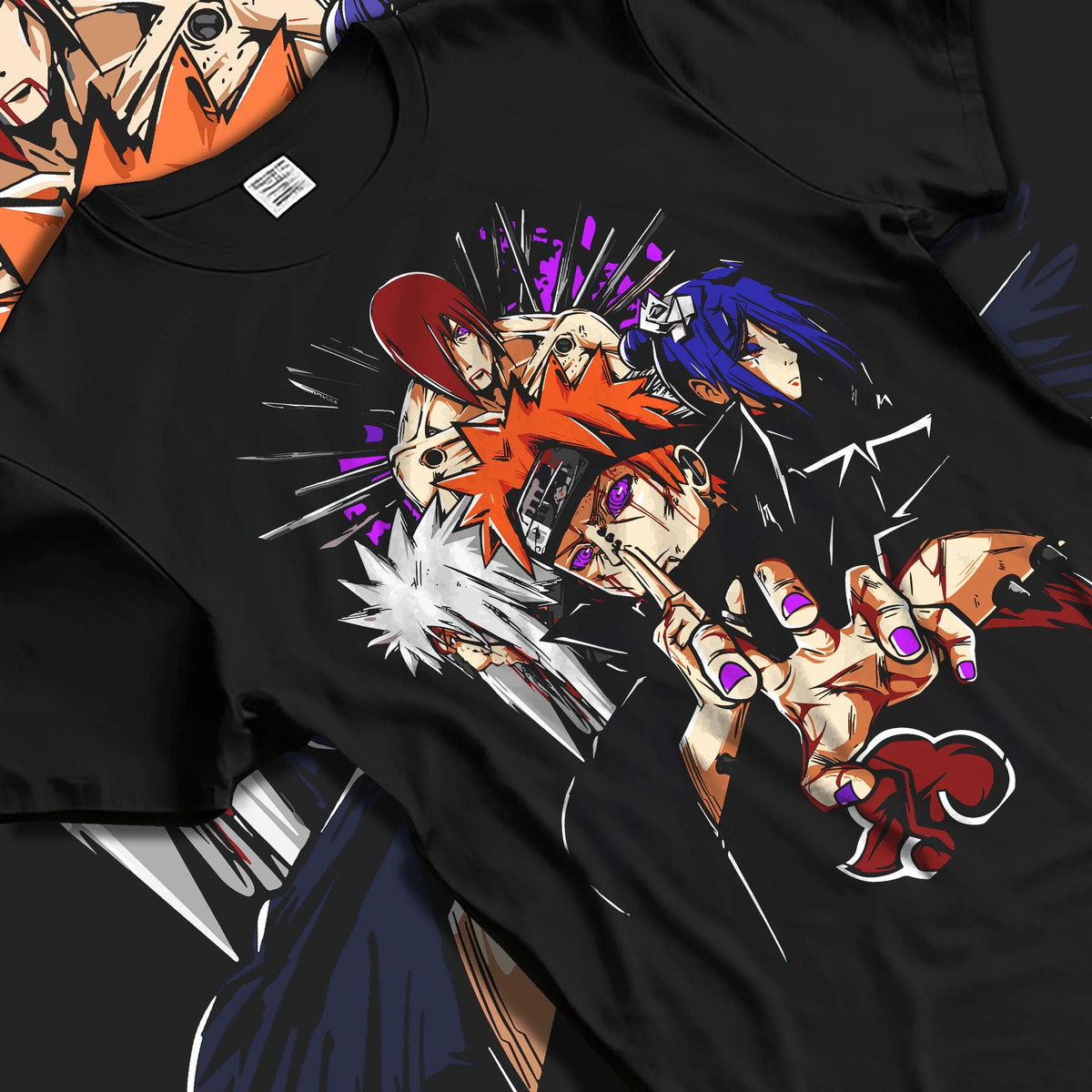 Black T-shirt laid flat with natural folds featuring Pain Six Paths Rinnegan Akatsuki Naruto artwork.