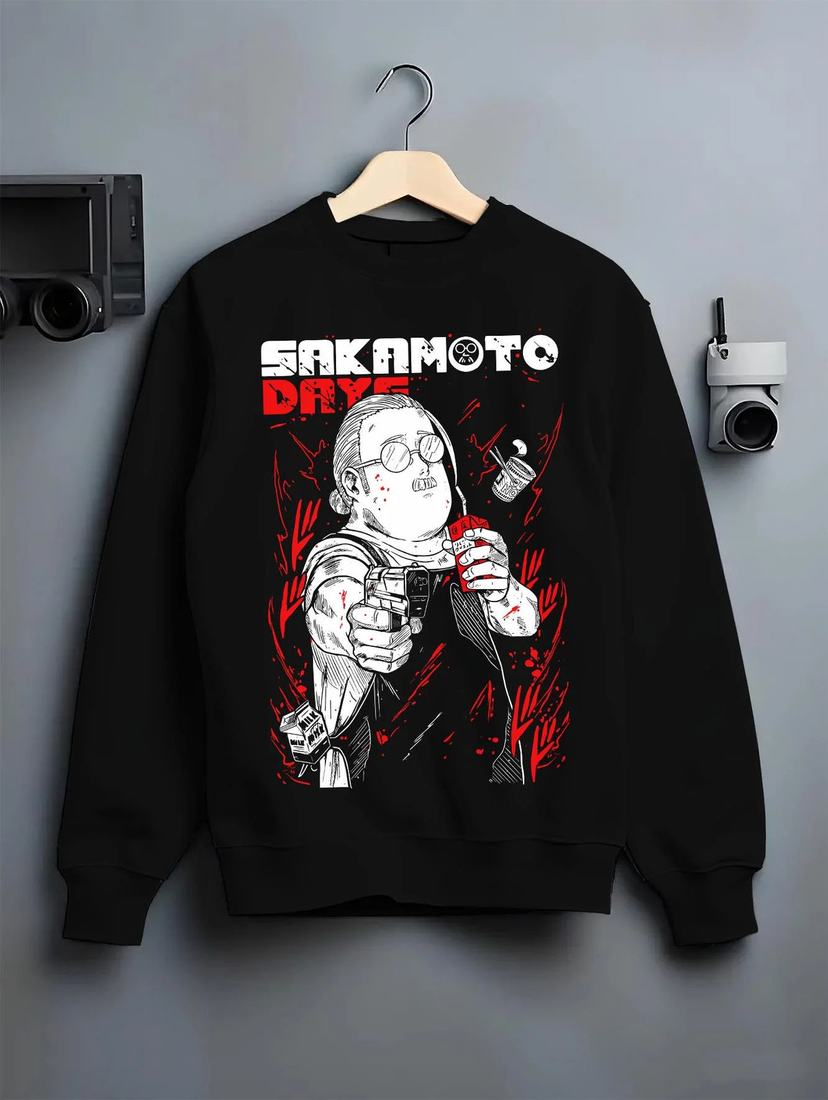 Black crewneck sweatshirt on hanger featuring Taro Sakamoto sketch hitman Sakamoto Days artwork.