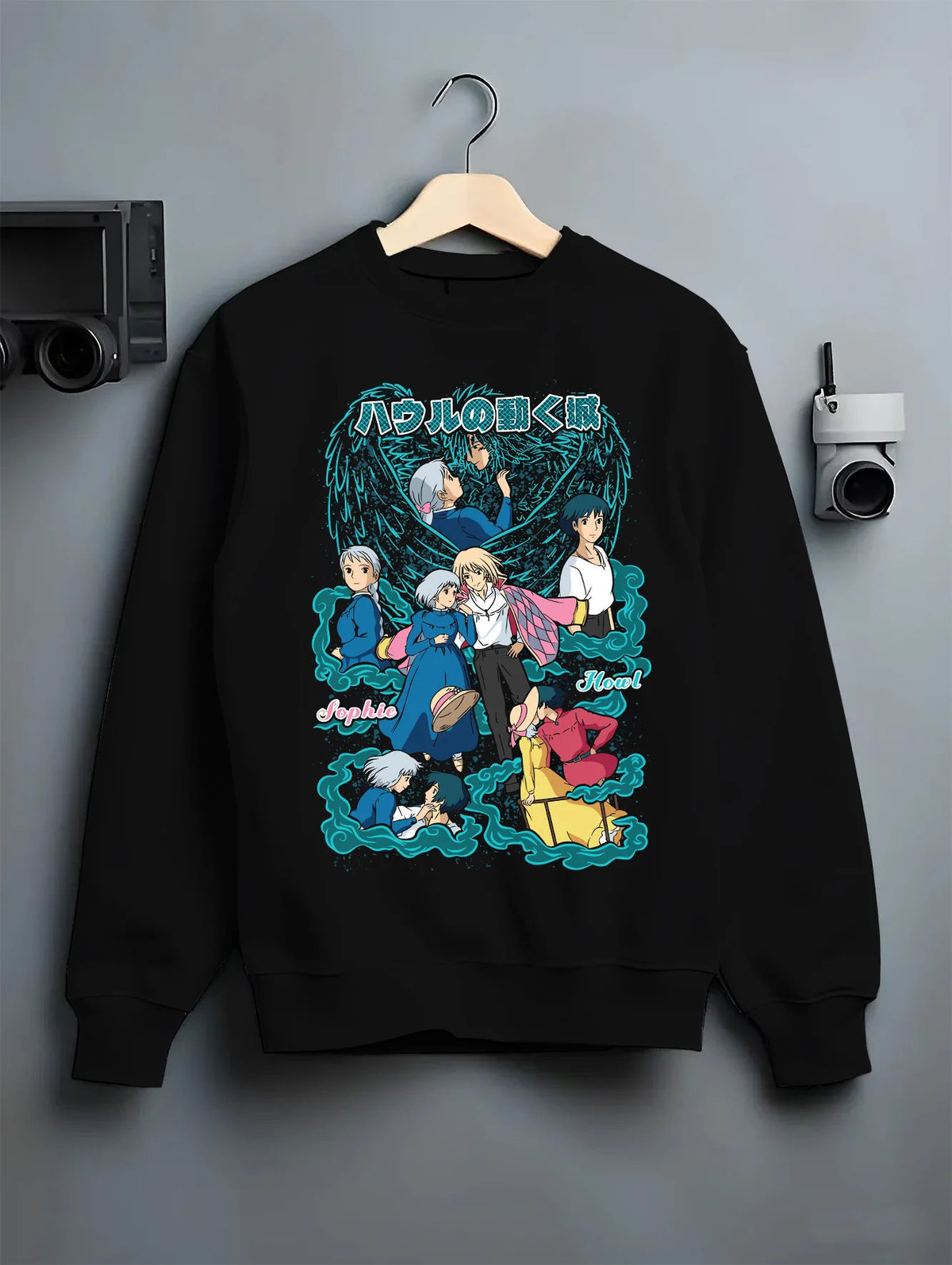 Black crewneck sweatshirt on hanger with Sophie, Howl and cast of Howl's Moving Castle from Studio Ghibli / Howl's Moving