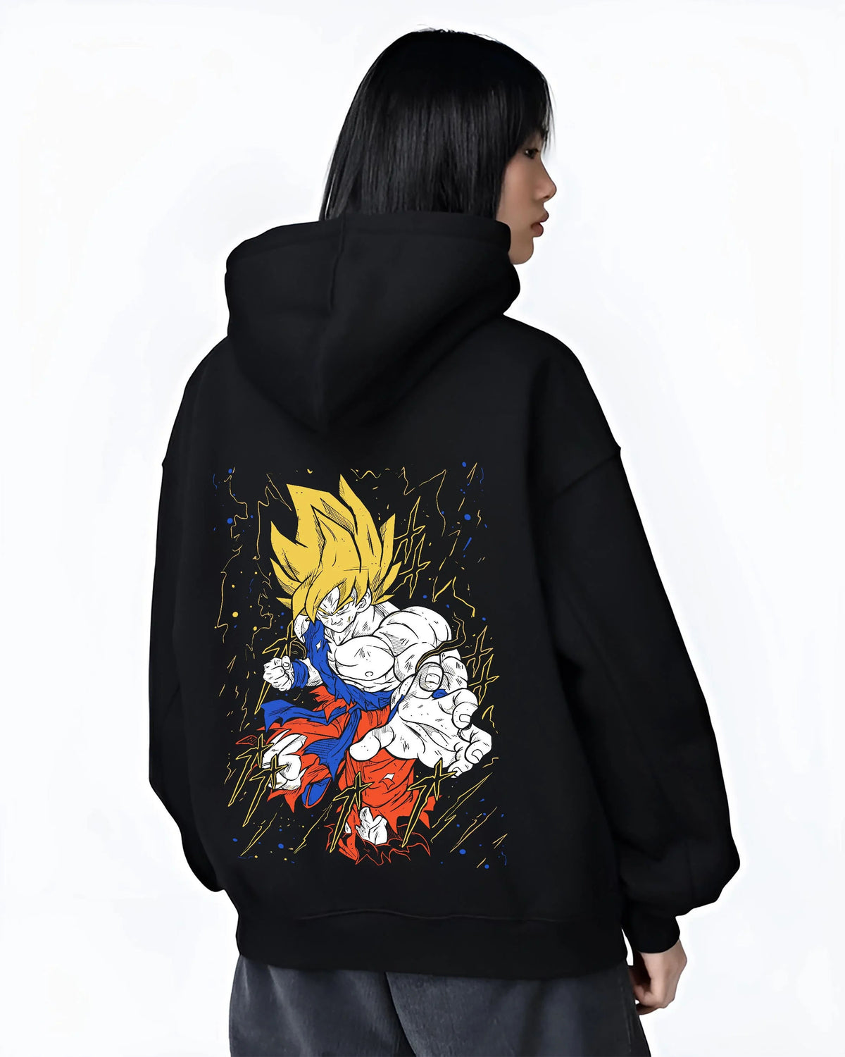 Black hoodie worn by female model from the back featuring Goku Super Saiyan battle power Dragon Ball Z artwork.