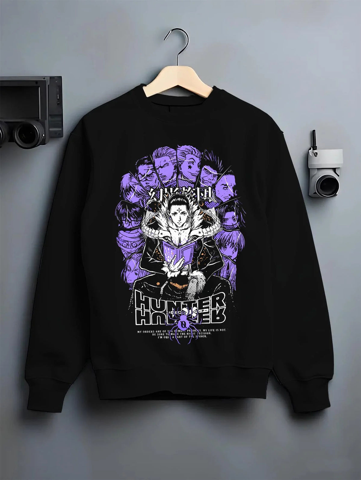 Black crewneck sweatshirt on hanger featuring Chrollo Lucilfer Phantom Troupe Hunter x Hunter artwork.