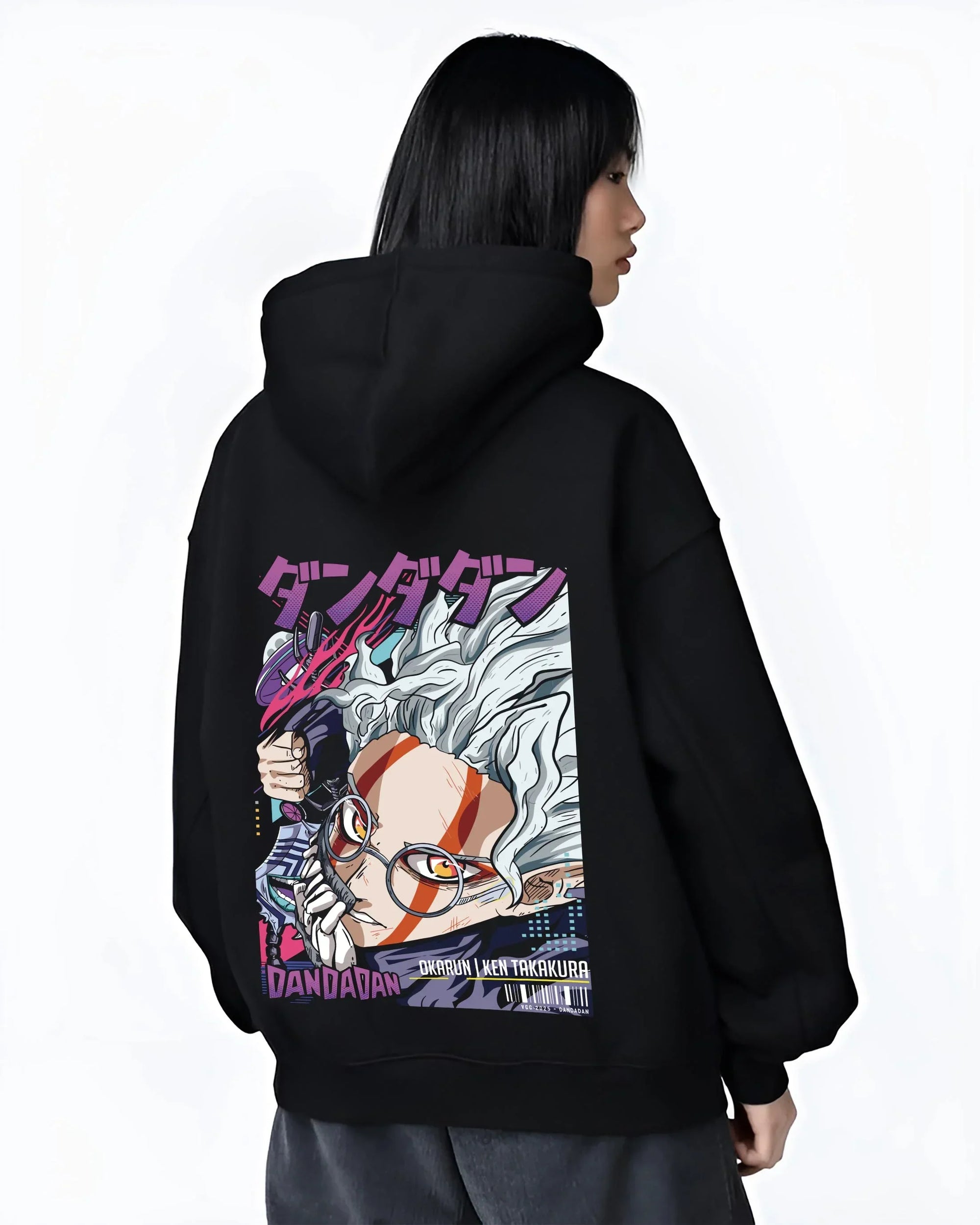 Black hoodie worn by female model, back view with Ken Takakura Hoodie Dandadan Dynamic Fight Scene graphic premium wear.