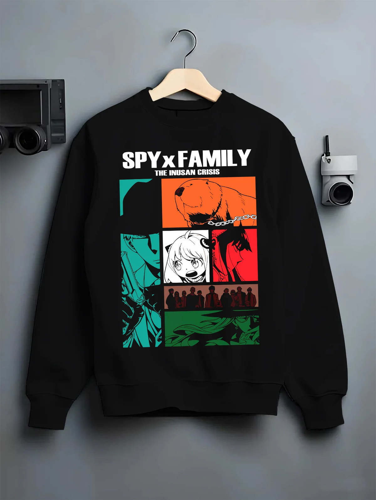 Black crewneck sweatshirt on hanger with Spy x Family manga collage illustrated back graphic