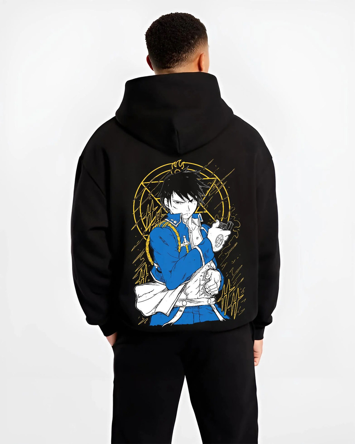 Black hoodie worn by male model from the back featuring Roy Mustang Flame Alchemist Fullmetal Alchemist artwork.