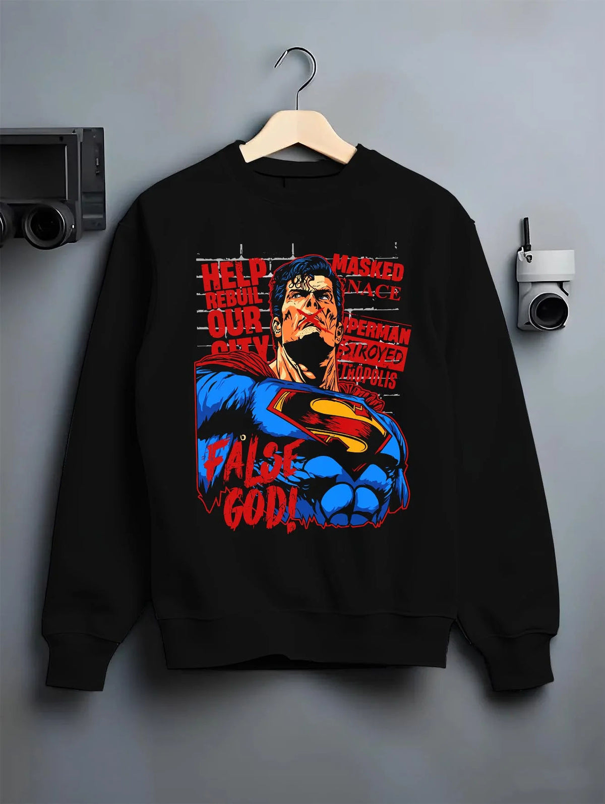 Black crewneck sweatshirt on hanger featuring Superman False God Man of Steel DC Comics artwork.