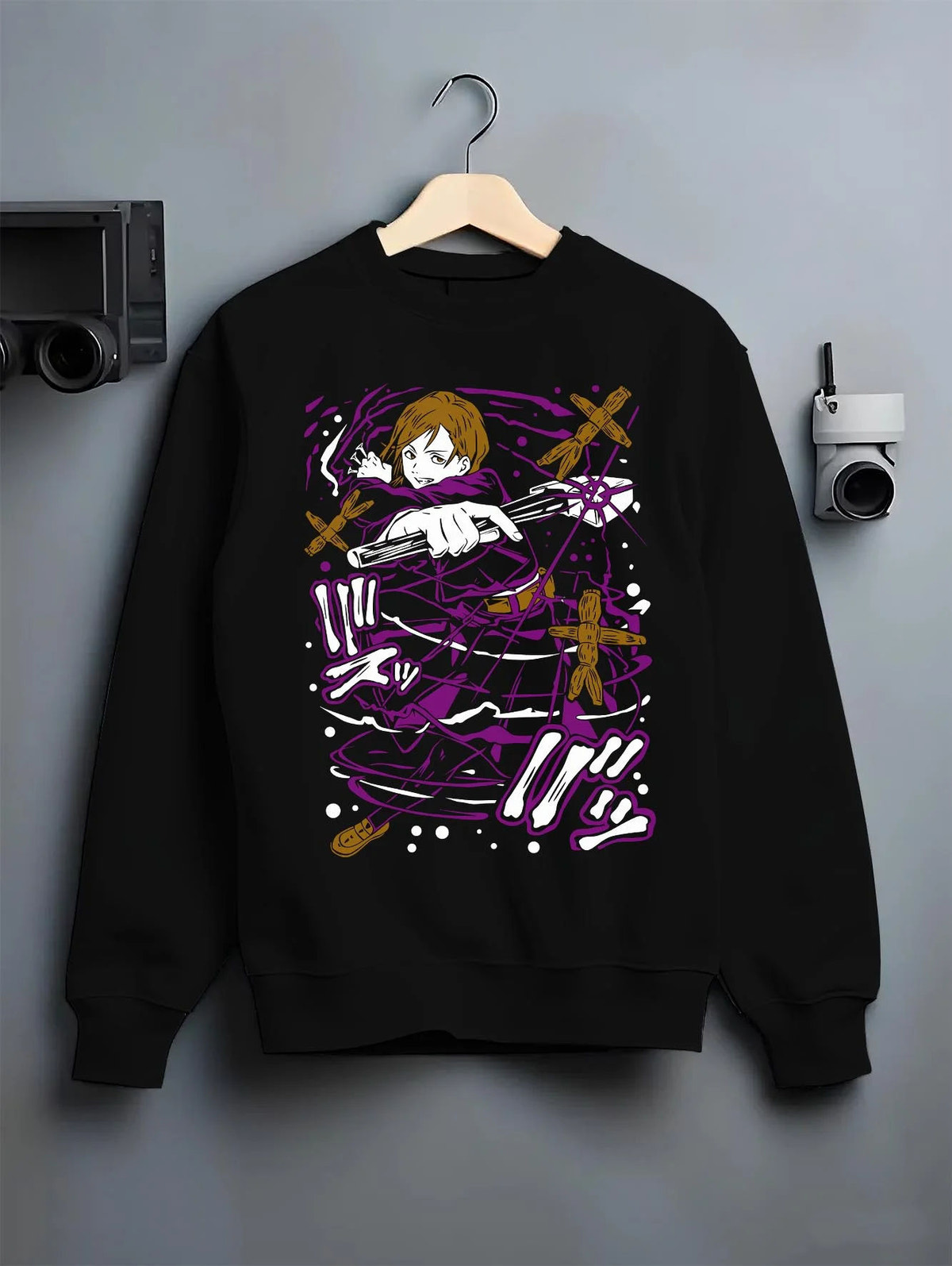 Black crewneck sweatshirt on hanger featuring Nobara Kugisaki Straw Doll Technique Jujutsu Kaisen artwork.