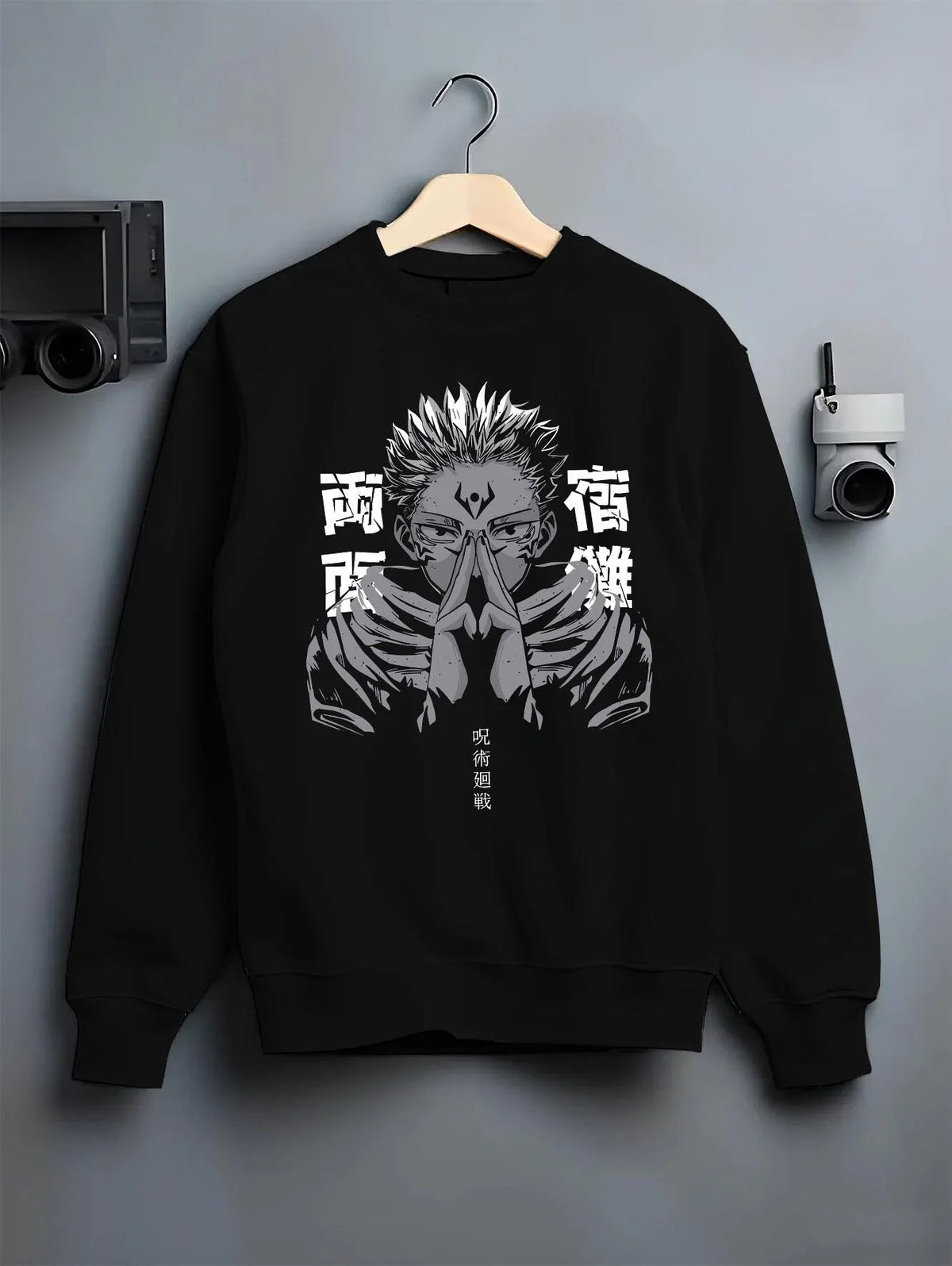 Black crewneck sweatshirt on hanger featuring Ryomen Sukuna domain hand sign Jujutsu Kaisen artwork.